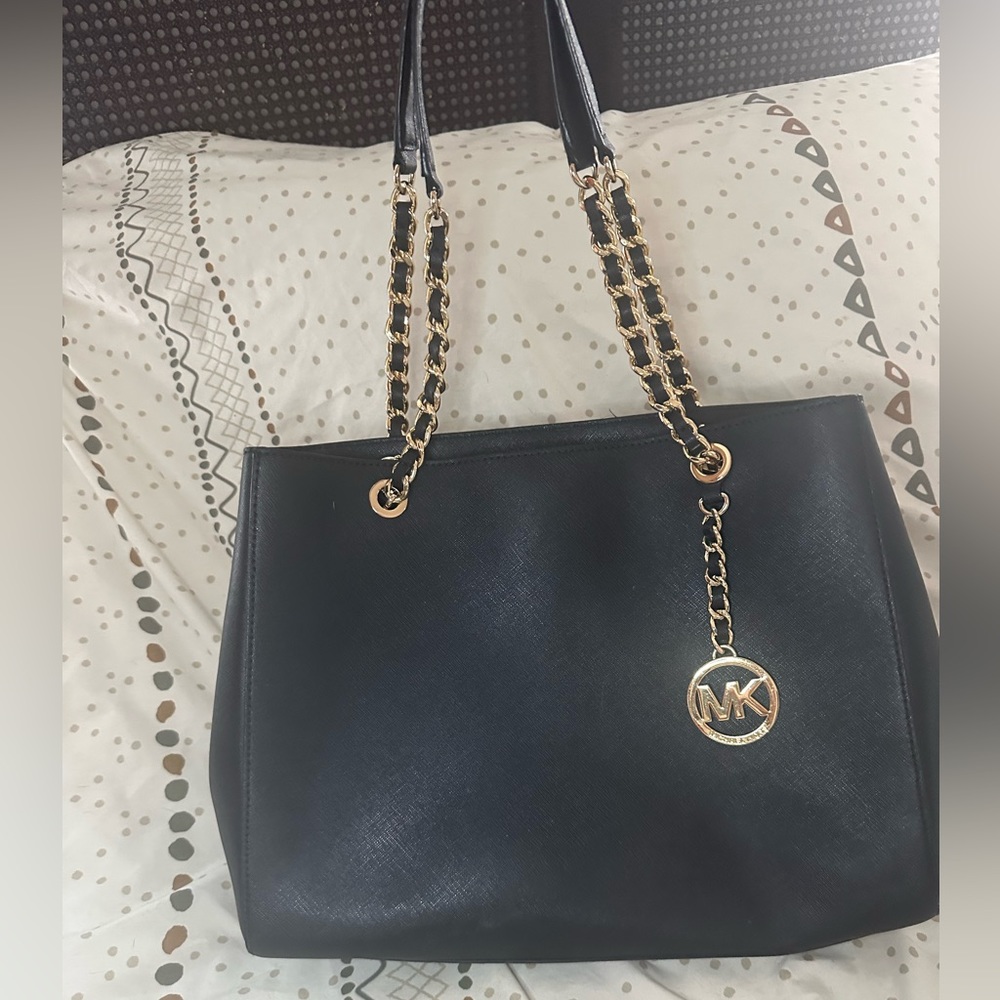 Black leather handbag with gold chain